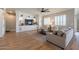 Inviting living room with custom built-ins, hardwood floors, recessed lighting and a comfortable seating area at 4235 S Snowcap Dr, Gilbert, AZ 85297
