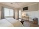 Spacious main bedroom with modern decor, wainscotting, and a door to the outside at 4235 S Snowcap Dr, Gilbert, AZ 85297