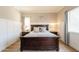 Inviting main bedroom with a large bed, classic decor, and plenty of natural light at 4235 S Snowcap Dr, Gilbert, AZ 85297