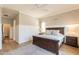 Cozy main bedroom featuring wainscotting, wood floors, and an inviting bed at 4235 S Snowcap Dr, Gilbert, AZ 85297