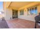 Comfortable patio with tile floor, light color and grill at 4235 S Snowcap Dr, Gilbert, AZ 85297