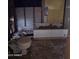 Dilapidated bathroom interior showing extensive damage and necessary renovations at 4304 N 55Th Dr, Phoenix, AZ 85031