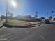 Vacant land with a view of the neighborhood and the boarded-up home at 4304 N 55Th Dr, Phoenix, AZ 85031