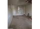 Spacious living room with neutral tile flooring awaiting renovation at 4304 N 55Th Dr, Phoenix, AZ 85031