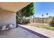 Back patio with seating area overlooking the spacious and private backyard at 4344 W Kimberly Way, Glendale, AZ 85308