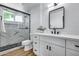 Contemporary bathroom with a glass-enclosed shower featuring stylish tile and modern fixtures at 4344 W Kimberly Way, Glendale, AZ 85308