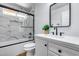 Updated bathroom featuring marble look tile, modern vanity, and updated fixtures at 4344 W Kimberly Way, Glendale, AZ 85308
