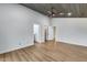 Spacious bedroom featuring a wood-look ceiling and hardwood floors, with access to the en suite bathroom at 4344 W Kimberly Way, Glendale, AZ 85308