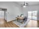 Well-lit dining area with simple decor and a view of the back yard from a sliding glass door at 4344 W Kimberly Way, Glendale, AZ 85308