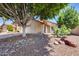 Charming home exterior featuring a well-maintained facade with desert landscaping at 4344 W Kimberly Way, Glendale, AZ 85308