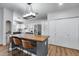 Bright kitchen featuring stainless steel appliances, eat-in breakfast bar, and light hardwood flooring at 4344 W Kimberly Way, Glendale, AZ 85308