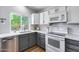 Well-equipped kitchen featuring stainless steel appliances, two-tone cabinetry, and ample counter space at 4344 W Kimberly Way, Glendale, AZ 85308
