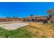 Backyard featuring a large concrete patio, a block wall, and an adjacent grass area at 4403 N 48Th Dr, Phoenix, AZ 85031