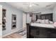 View of staged bedroom with dark furniture, accent rug, and ceiling fan at 4403 N 48Th Dr, Phoenix, AZ 85031