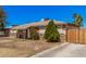 Street view of a single-story home featuring a stone accent facade and tidy front yard at 4403 N 48Th Dr, Phoenix, AZ 85031