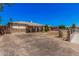 Wide view of a single-story home featuring a stone accent facade and long driveway at 4403 N 48Th Dr, Phoenix, AZ 85031