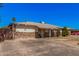 Street view of a single-story home featuring a stone accent facade and tidy front yard at 4403 N 48Th Dr, Phoenix, AZ 85031