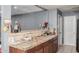 Kitchen features tile countertops and brown wood cabinets with room for dining at 4403 N 48Th Dr, Phoenix, AZ 85031