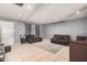 Spacious living room with neutral walls, tile floors, and comfortable dark sofas at 4403 N 48Th Dr, Phoenix, AZ 85031