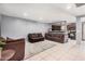 Bright living room with tile floors, comfortable seating, and an open layout at 4403 N 48Th Dr, Phoenix, AZ 85031