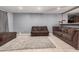 Open living room with tile floors, comfortable seating, and neutral wall color at 4403 N 48Th Dr, Phoenix, AZ 85031