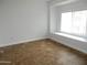 This bedroom features tile floors, a window bench, and neutral paint at 4465 E Paradise Village S Pkwy # 1200, Phoenix, AZ 85032
