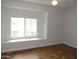 This bedroom boasts ample natural light and tile flooring for easy maintenance at 4465 E Paradise Village S Pkwy # 1200, Phoenix, AZ 85032