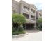 Inviting condo exterior featuring a private garage, well-maintained landscaping, and neutral color palette at 4465 E Paradise Village S Pkwy # 1200, Phoenix, AZ 85032