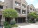 Attractive condo building with nicely maintained landscaping, private patios and garages at 4465 E Paradise Village S Pkwy # 1200, Phoenix, AZ 85032