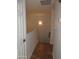 A well-lit hallway with tile floors connects the various spaces of the home at 4465 E Paradise Village S Pkwy # 1200, Phoenix, AZ 85032