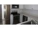Well-equipped kitchen with stainless steel appliances, white cabinets, and efficient layout for cooking at 4465 E Paradise Village S Pkwy # 1200, Phoenix, AZ 85032