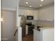Bright kitchen featuring stainless steel appliances, white cabinetry and countertops with modern recessed lighting at 4465 E Paradise Village S Pkwy # 1200, Phoenix, AZ 85032