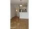 Bright, open floor plan with ceramic tile flooring, neutral walls, and a glimpse of the kitchen appliances at 4465 E Paradise Village S Pkwy # 1200, Phoenix, AZ 85032