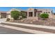 Charming home featuring desert landscaping in the front yard and an inviting entryway at 5107 N 194Th Dr, Litchfield Park, AZ 85340