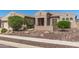 Charming home featuring desert landscaping in the front yard and an inviting entryway at 5107 N 194Th Dr, Litchfield Park, AZ 85340