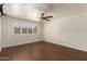Bedroom showcasing wood floors, neutral walls, ceiling fan and a window with shutters at 6035 N 9Th Ave, Phoenix, AZ 85013