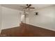Spacious bedroom with ceiling fan, tv mount and wood floors at 6035 N 9Th Ave, Phoenix, AZ 85013