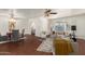 Bright living room with lots of seating, light-colored walls, hardwood floor, and a ceiling fan at 6035 N 9Th Ave, Phoenix, AZ 85013