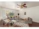 Cozy living room with hardwood floors, comfortable seating, decorative rugs, and lots of natural light at 6035 N 9Th Ave, Phoenix, AZ 85013