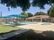 Community pool featuring sunshades, lounge chairs, a spa, and a covered patio area for relaxing and entertaining at 6035 N 9Th Ave, Phoenix, AZ 85013