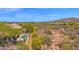 Aerial view of community showing large lots, desert vegetation, and neighborhood pool at 7283 E Brisa Dr, Scottsdale, AZ 85266