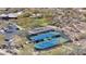 Aerial view of community tennis courts surrounded by native desert vegetation at 7283 E Brisa Dr, Scottsdale, AZ 85266