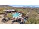 Stunning community pool, spa, and clubhouse surrounded by mature trees and desert landscaping at 7283 E Brisa Dr, Scottsdale, AZ 85266