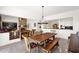 Elegant dining area with a wooden table, decorative light fixture, and access to the living room at 7283 E Brisa Dr, Scottsdale, AZ 85266