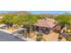 Attractive single-story home with desert landscaping, mature trees, and a tile roof in an upscale community at 7283 E Brisa Dr, Scottsdale, AZ 85266