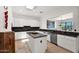 Kitchen with island, stainless steel appliances, tile floors, and ample storage at 7283 E Brisa Dr, Scottsdale, AZ 85266