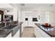 Spacious kitchen with granite counters, stainless steel appliances, and white cabinets at 7283 E Brisa Dr, Scottsdale, AZ 85266