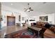 Open-concept living room with high ceilings, comfortable leather seating, and tile floors throughout at 7283 E Brisa Dr, Scottsdale, AZ 85266