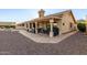 Extended backyard patio with room to grill and views of the desert landscape at 8061 E Lavender Dr, Gold Canyon, AZ 85118
