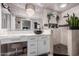 Luxurious bathroom with a chandelier, double vanity, and an elegant walk-in shower at 8061 E Lavender Dr, Gold Canyon, AZ 85118